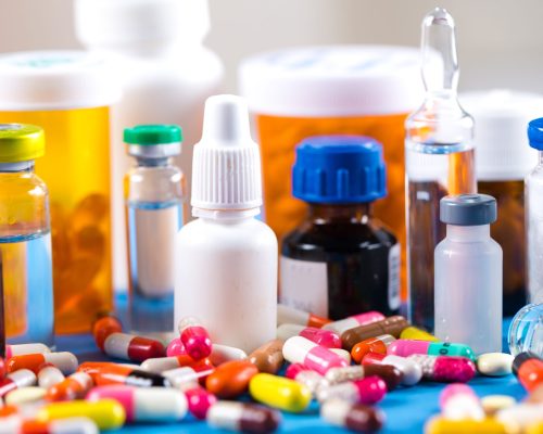 Colorful pills and tablets on background